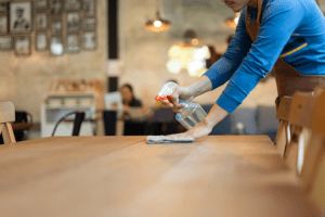 waitress cleaning table