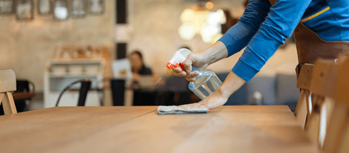 waitress cleaning table